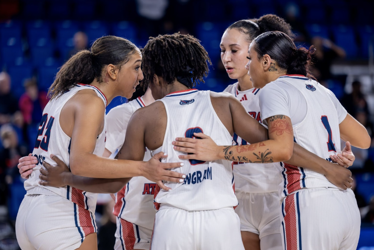 Jada Moore (left), Stefanie Ingram (middle), Mya Perry and Ta’Zaih Jenks (right) huddled up during their home game versus UAB.